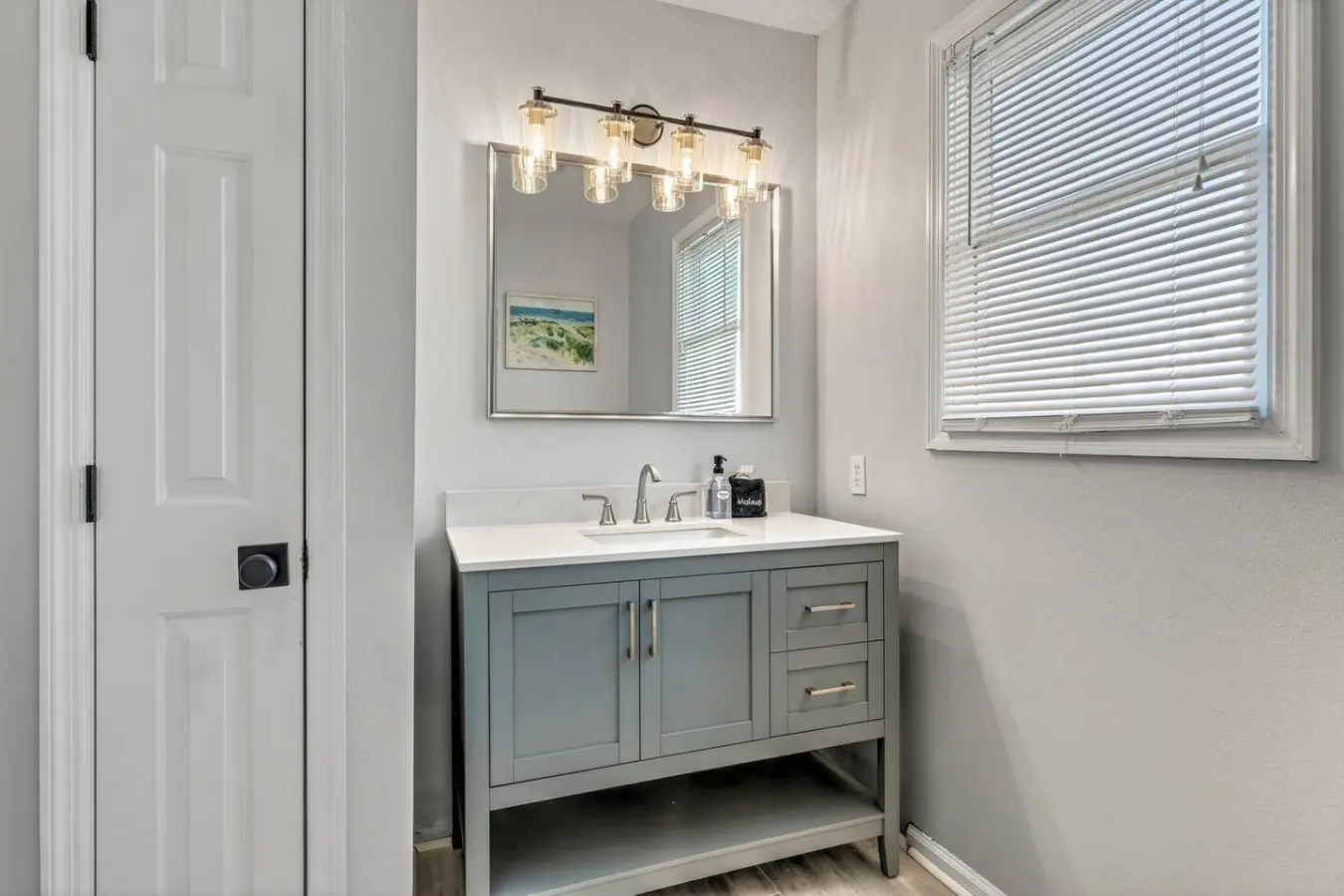 This bright, beautifully appointed bathroom with its soft lighting and spa-like finishes is the perfect place to rinse off the salt and sand before heading back out for round two.