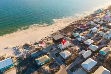 Nestled in a charming beach community with direct sand access and endless ocean views, this elevated beachfront home is basically your front-row seat to the perfect coastal escape.