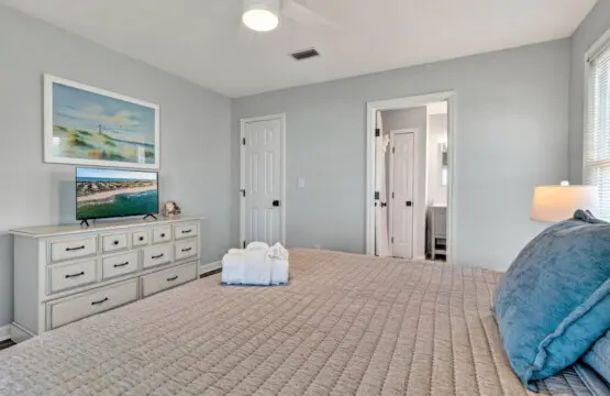 This spacious master suite has all the coastal calm you need—soft light, plenty of room to stretch out, and a peaceful retreat that's perfect for recharging between beach adventures.