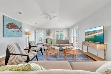 This spacious beachfront living room is basically your front-row seat to endless ocean views, complete with plenty of space to spread out and soak it all in.