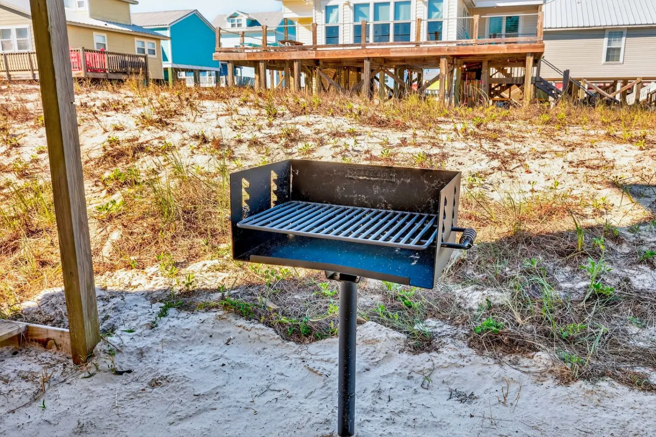 Fire up the grill and cook dinner with your toes in the sand—this beachfront home puts you steps away from everything you need for the perfect coastal getaway.