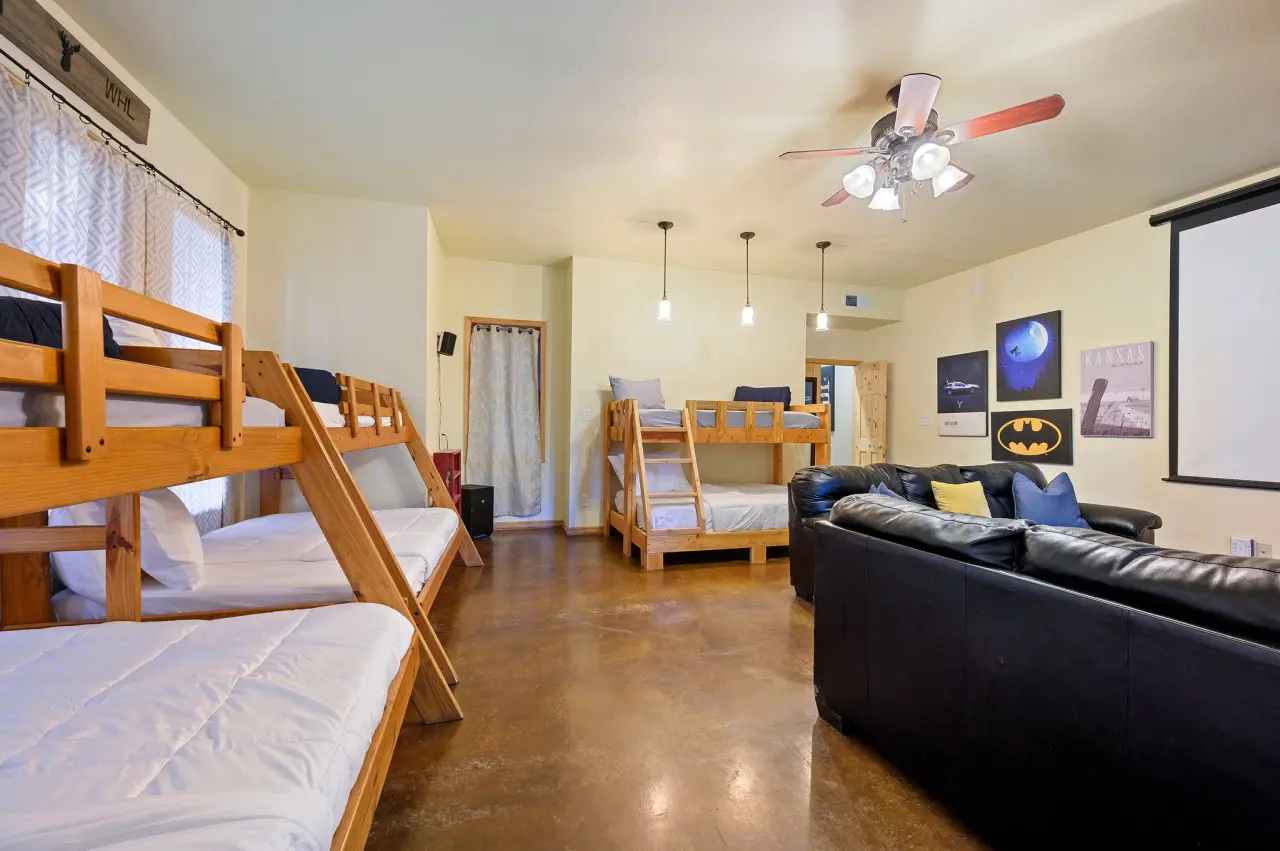 Our cabin's room with a theater and bunk beds offers the perfect blend of entertainment and adventure for the ultimate family getaway