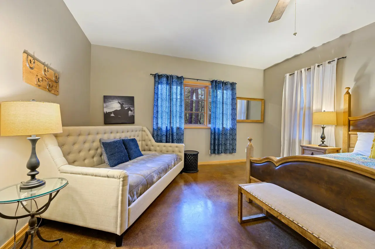A cozy couch, providing the perfect spot to unwind, read a book, or simply enjoy the tranquility of your surroundings.