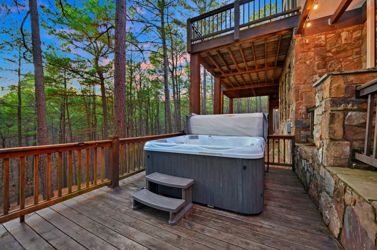The hot tub on the deck beckons, offering a luxurious retreat where you can unwind, relax, and soak away the stresses of the day under the starlit sky.