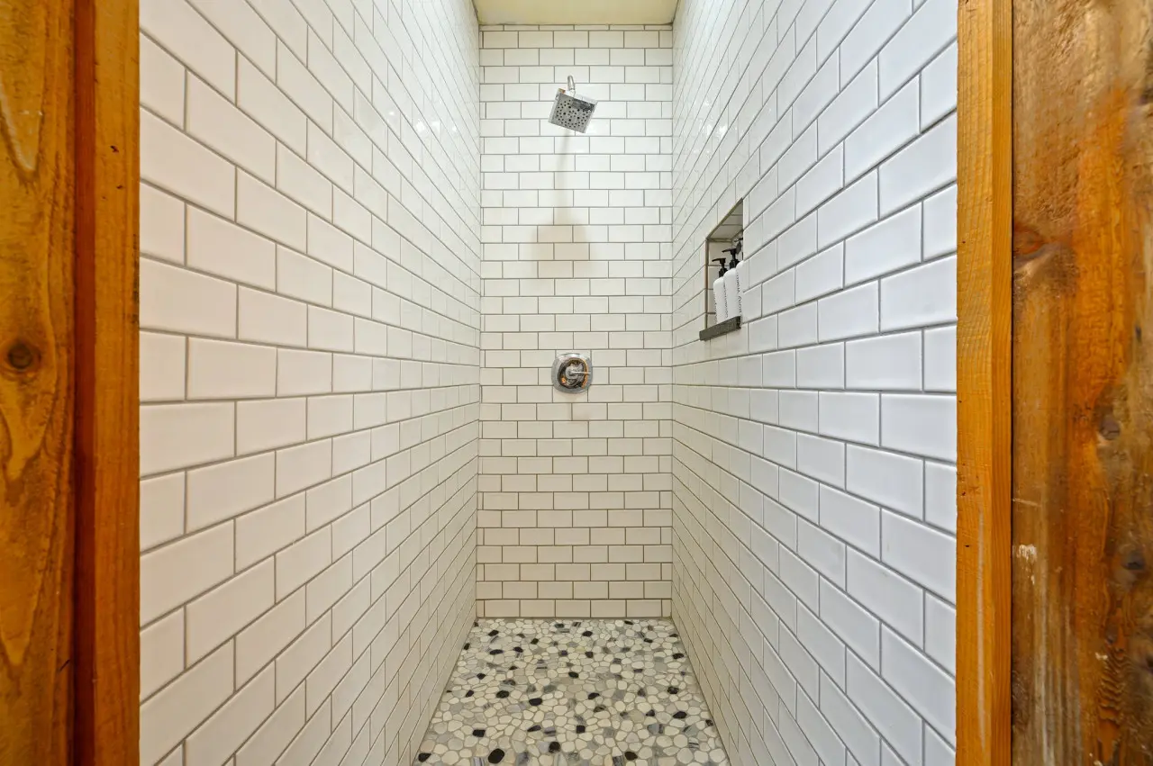 Our bathroom is a serene sanctuary, where rustic charm meets modern comforts, offering a haven for relaxation and rejuvenation