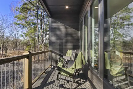 Rocking chairs and green throw blankets on the side deck for when you need a quiet moment away from the group.