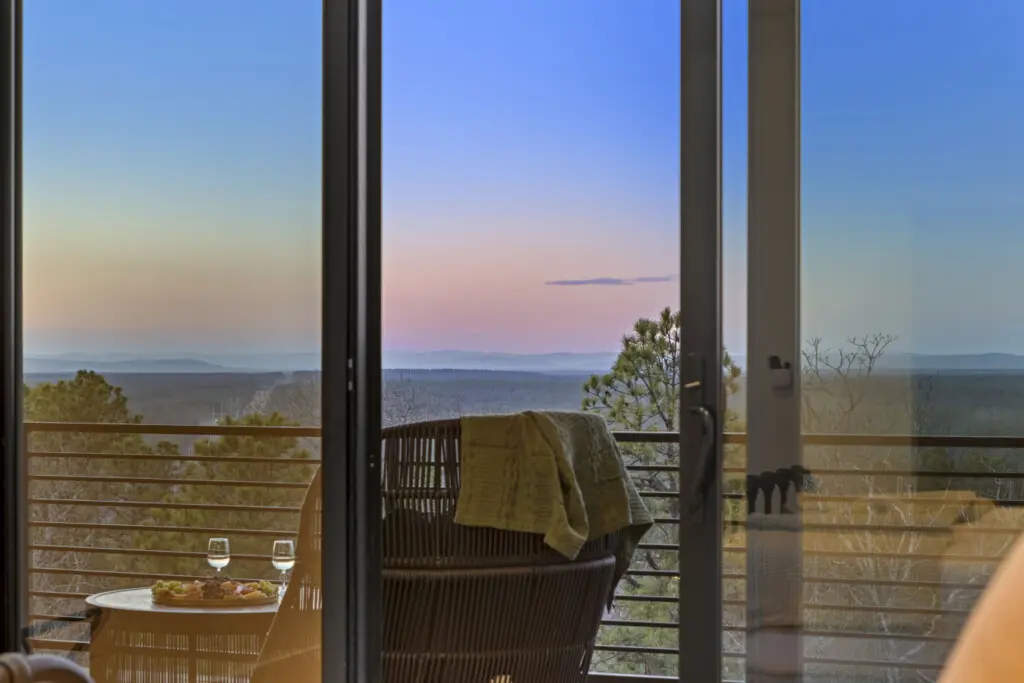 That hazy Broken Bow view at golden hour from the balcony — this is peak relaxation.