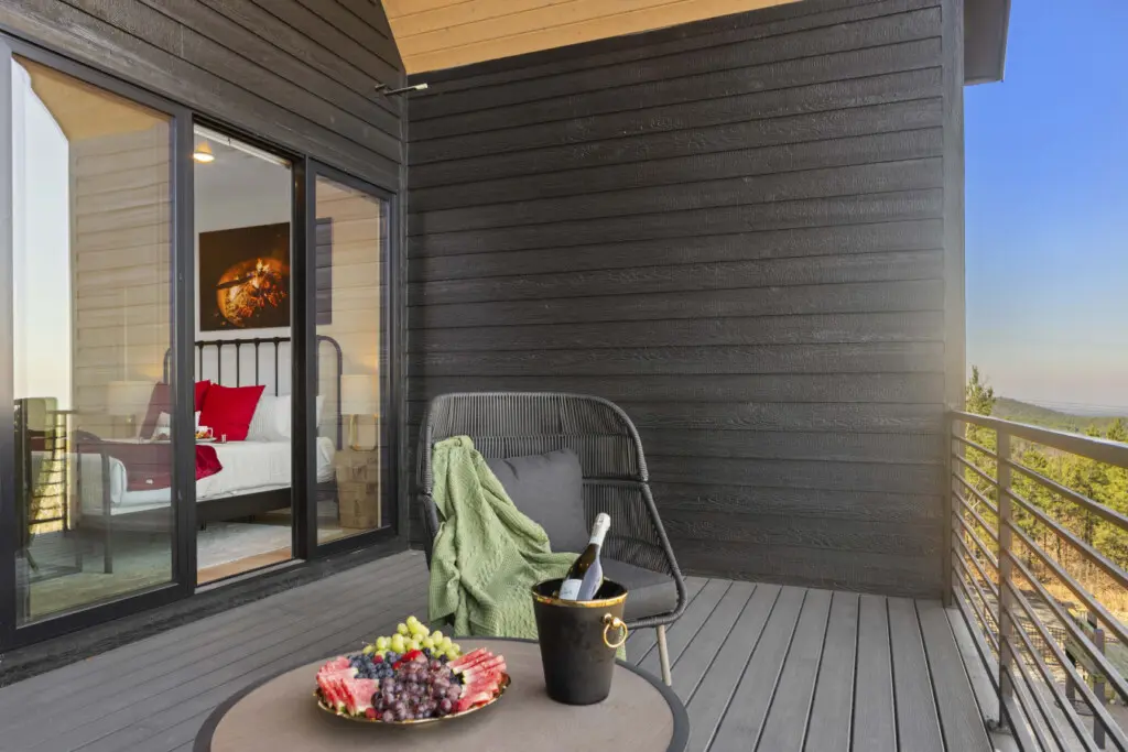 This bedroom deck looks out over the pines — made for slow mornings and doing absolutely nothing.