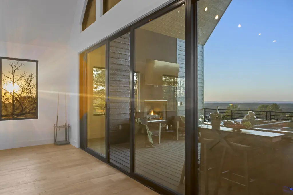 Golden hour lighting up the living room while the fire glows out on the deck.