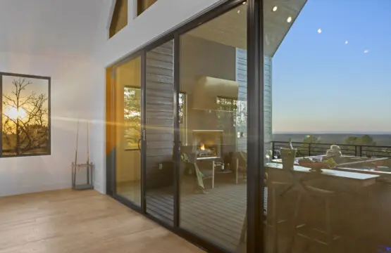 Golden hour lighting up the living room while the fire glows out on the deck.