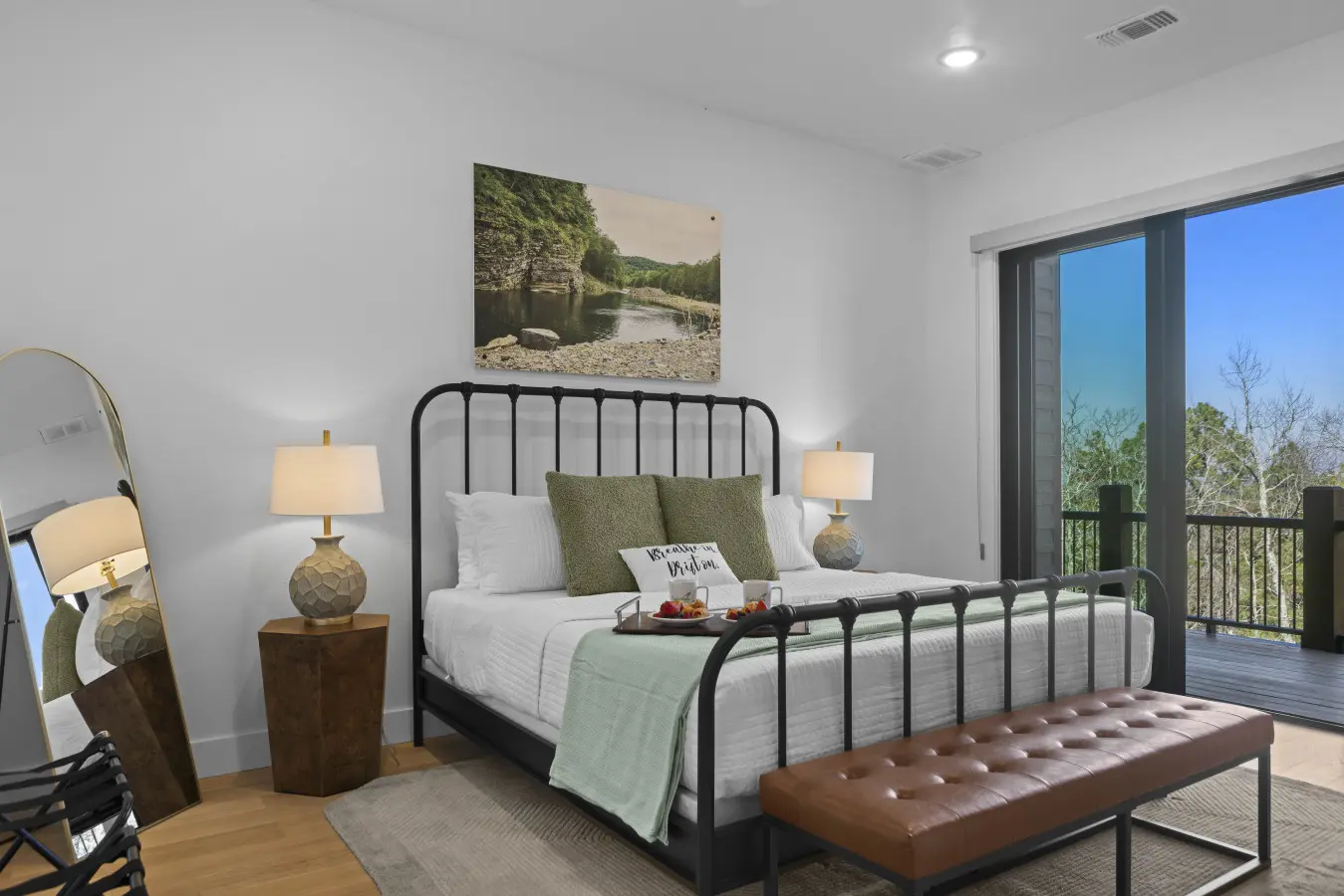 Wake up to treetop views in this king suite that opens right onto the deck.