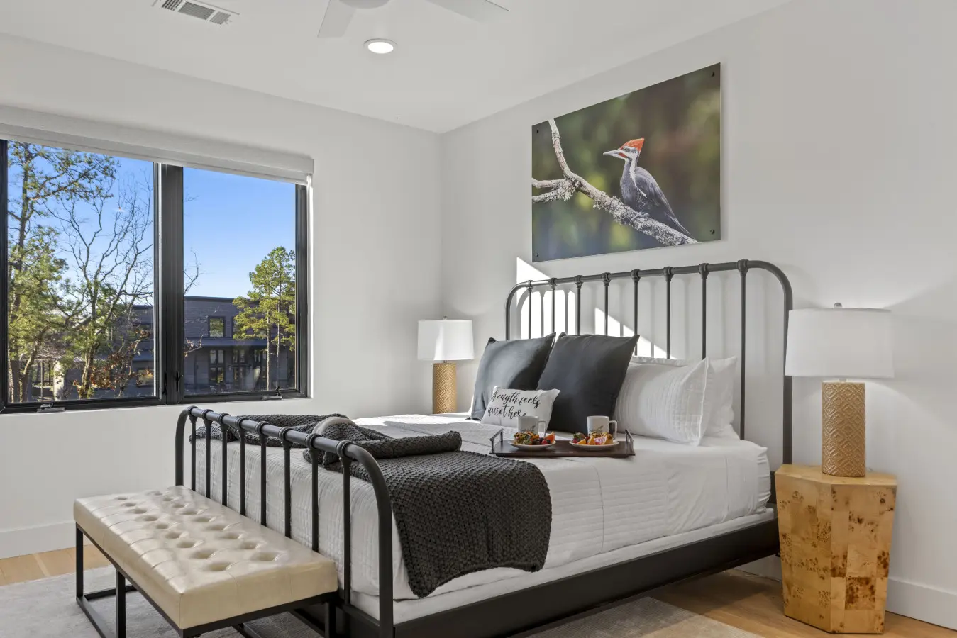 Wake up to those gorgeous Broken Bow views from this stylish bedroom with its sleek metal bed frame and modern finishes.