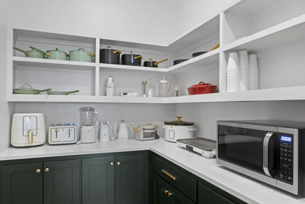 The walk-in pantry is stocked with matching cookware and every small appliance you could need for feeding a crowd.