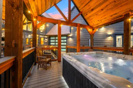 Nothing beats soaking in the hot tub under the stars from this covered deck.