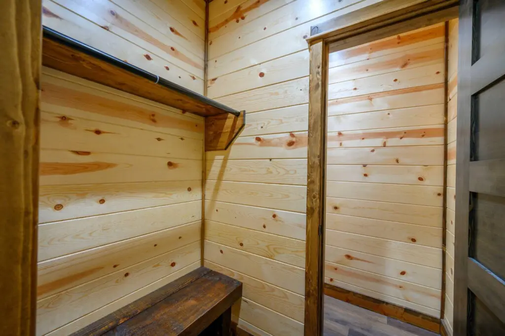 Cozy wooden sauna with bench seating and natural light—the perfect spot to unwind after a day outdoors.