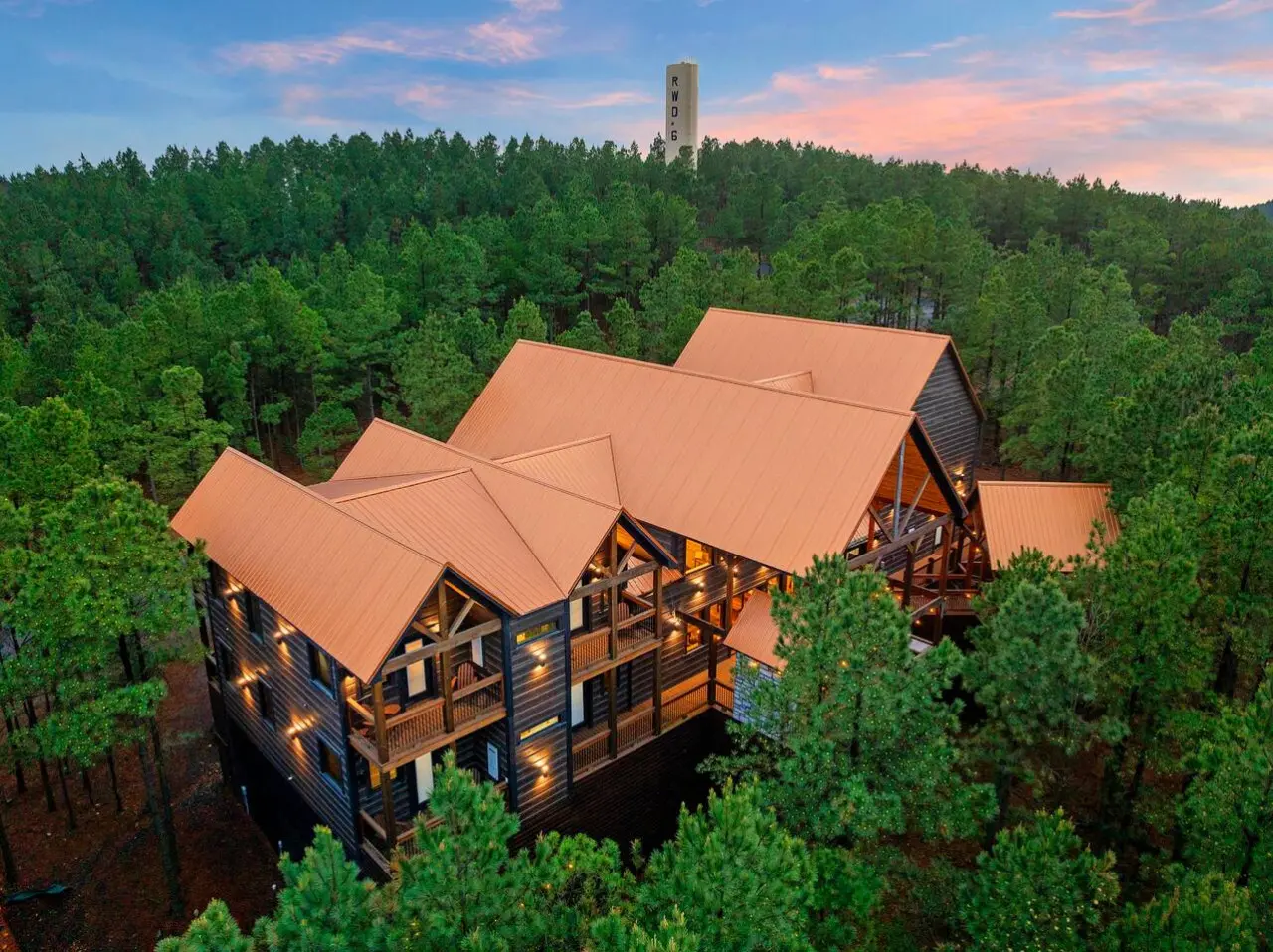 This stunning lodge sits nestled in towering pines with soaring ceilings, multiple decks, and incredible forest views.