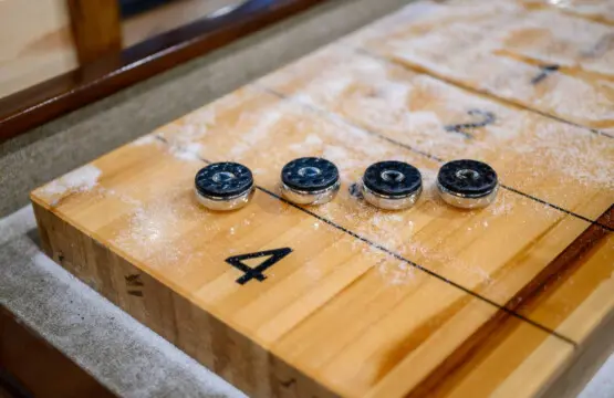 This stunning shuffleboard table is perfect for friendly competition right in your living space.