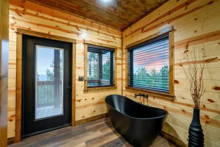 Soak in that freestanding tub while gazing at mountain views through floor-to-ceiling windows.