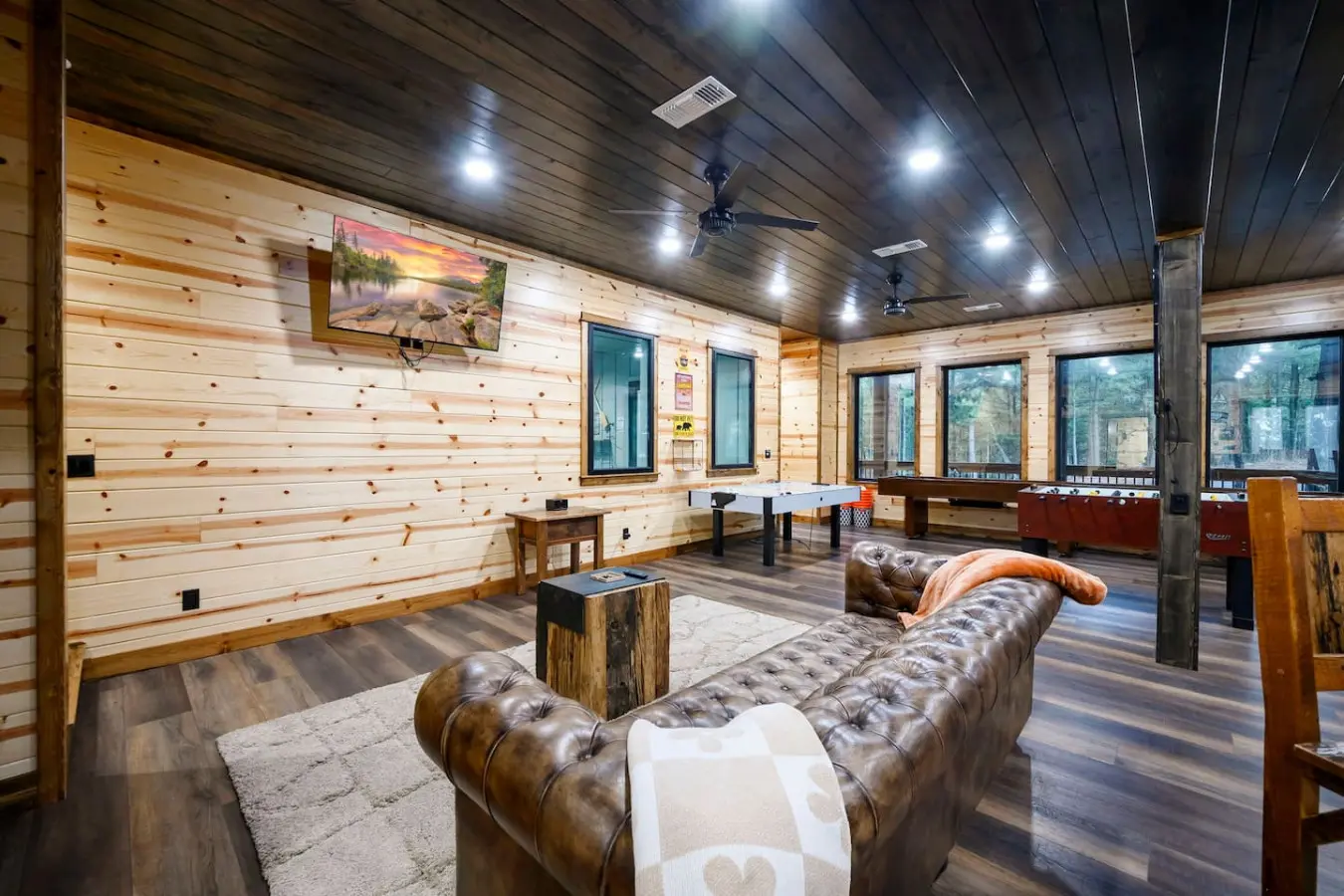 This spacious lodge game room has everything you need to keep everyone entertained with foosball, pool, and gorgeous views.