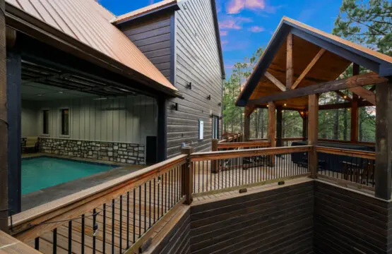 Your own private indoor pool with covered deck space and forest views—basically every outdoor living dream in one spot.