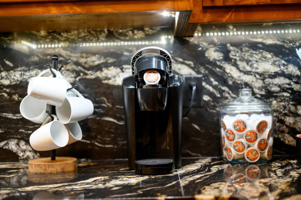 Stunning granite countertops with mountain views and ambient lighting make this kitchen a chef's dream.