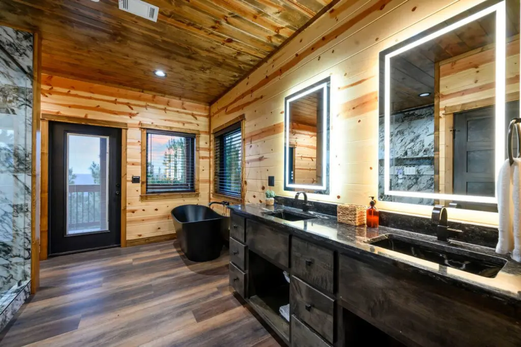 This master bath is absolutely stunning with dual vanities, a soaking tub, and those incredible mountain views from the windows.