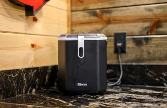 This cozy cabin setup has convenient charging stations built right into the rustic wooden shelving.