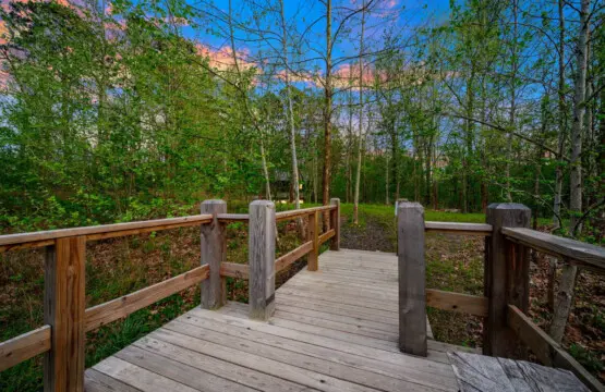 Relax outdoors on the spacious deck, perfect for enjoying the peaceful pond.