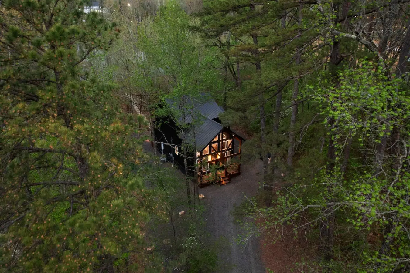 This inviting cabin deck offers peaceful views of the tranquil pond.