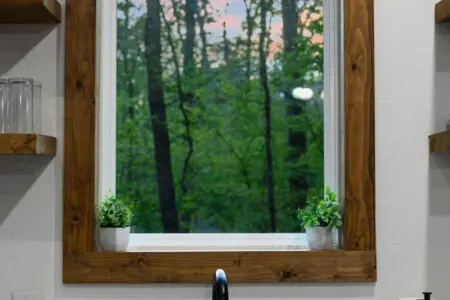 Wake up refreshed in a comfortable bedroom overlooking the water.