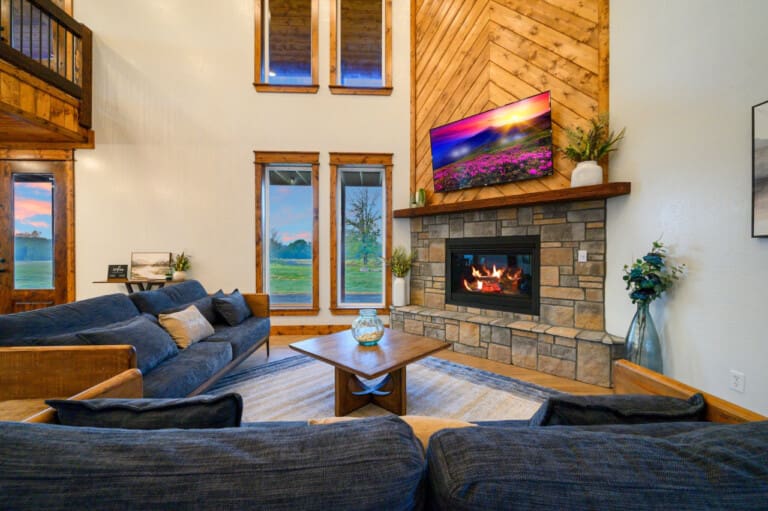 Snuggle up beside the indoor gas fireplace and stay seamlessly connected with the presence of smart TVs located throughout the cabin.