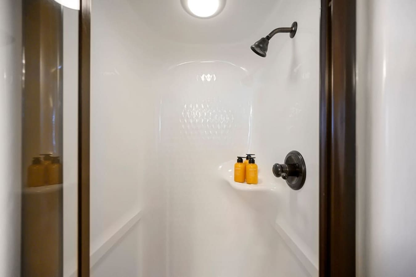 Step into our pristine bathroom, complete with a rejuvenating shower and a set of luxurious soaps.