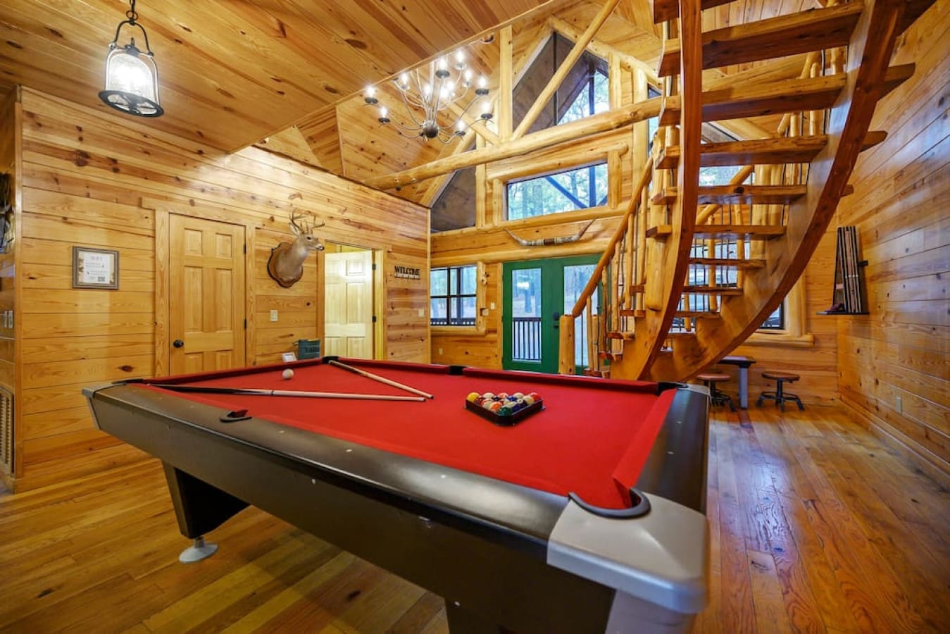This spacious retreat also offers a surplus of games. After an adventurous day out, enjoy your evening by coming back to the cabin to make core memories beating your friends and family in a game of pool!