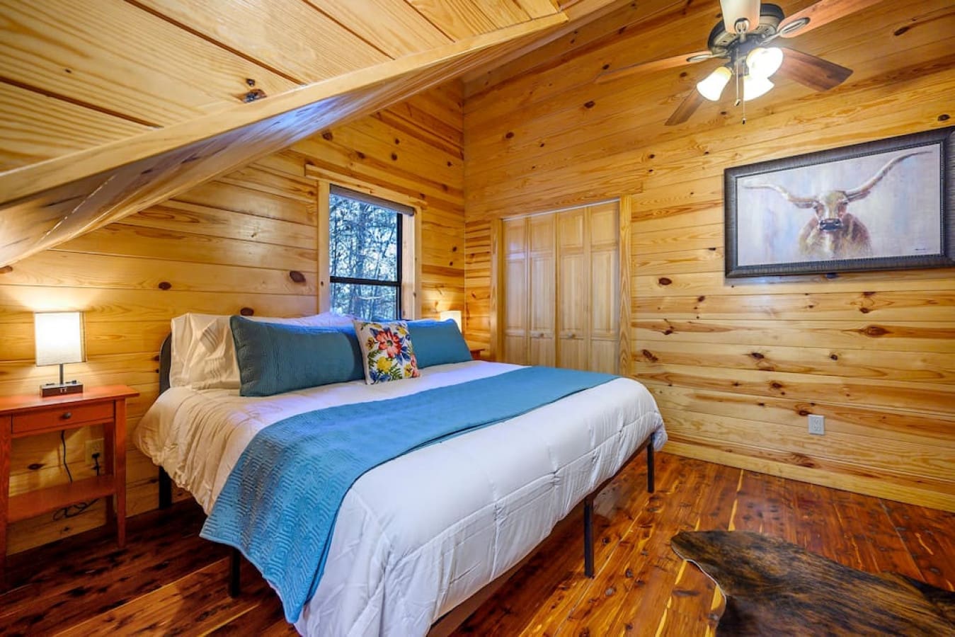 Another king suite that features a very soft, warm comforter with a thick quilt. Available here is a private closet, en suite bathroom, and smart TV.