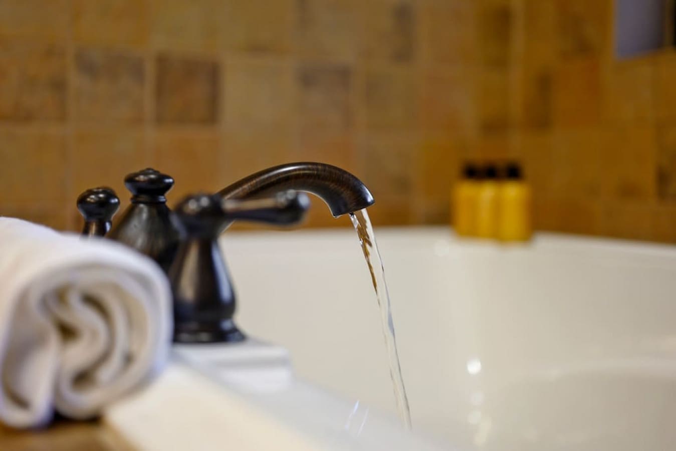 Enjoy a soothing bath with the convenience of running water in the tub's faucet. We provide you with a set of soap and a clean towel for a refreshing and revitalizing experience.