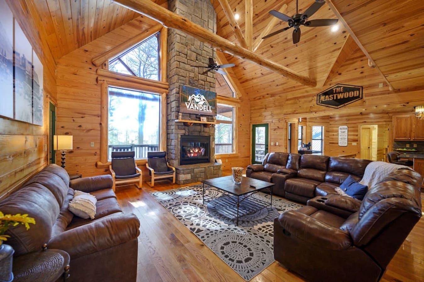 The living area has multiple couches that provide plenty of seating for everyone. The bold Eastwood logo stands loud and proud in this inviting space.
