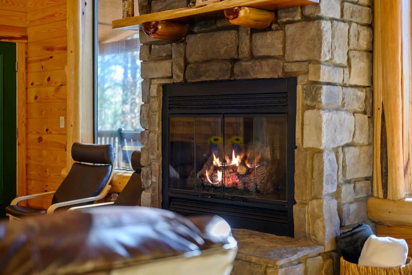 Our indoor fireplace is the perfect spot to relax in style. The warm glow of the flames and the natural stone surrounding create a soothing atmosphere. The comfortable furnishings and plush throw blankets invite you to sink in and stay awhile.