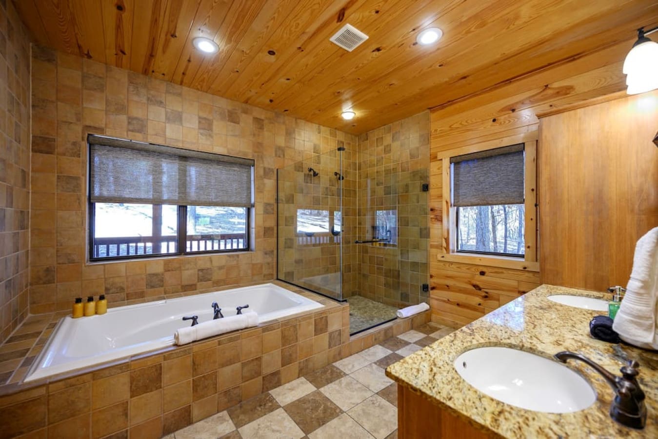 The master en-suite bathroom features a wide tub, perfect for a late night bubble bath, a double headed shower and a double basin sink. Leave feeling like royalty in this capacious area as you get ready for the day with your significant other by your side