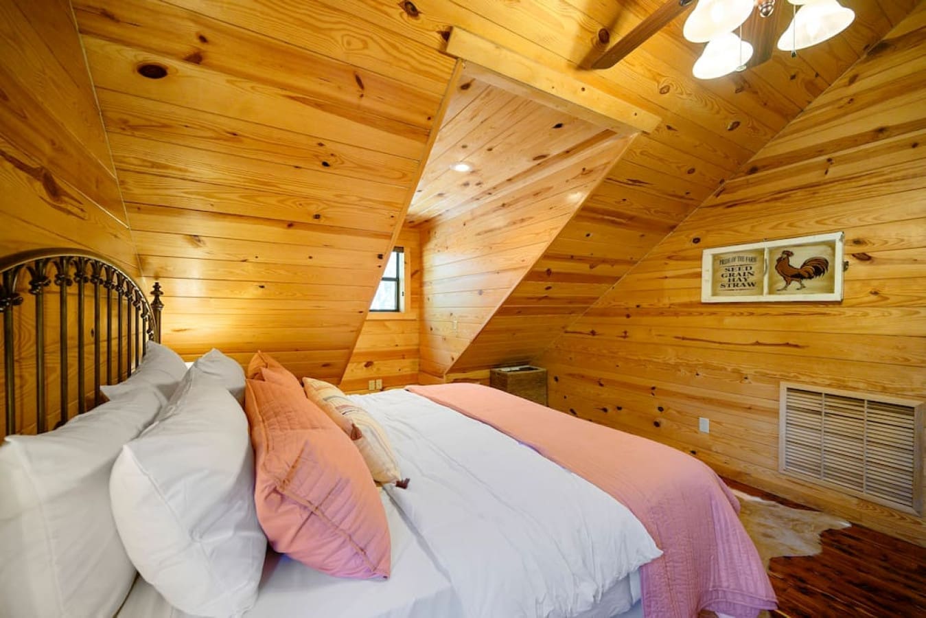 Experience the epitome of comfort in our bedroom, where you'll find a spacious bed adorned with a complete set of plush pillows and a supportive mattress for a restful night's sleep.