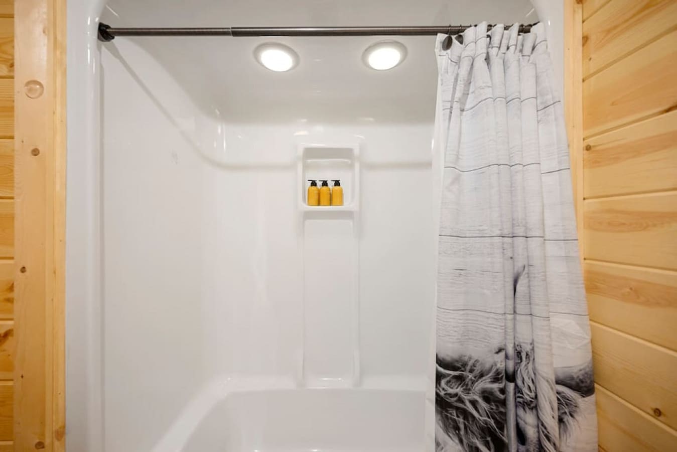Step into the refreshing oasis of our bathroom shower, where a tasteful shower curtain provides privacy and style.