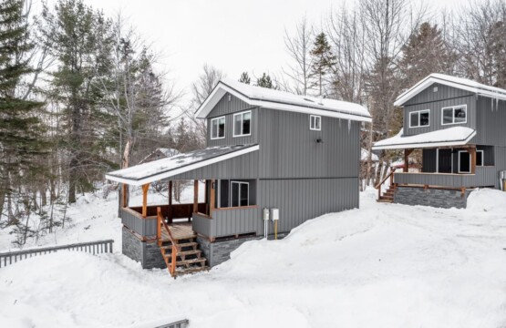 In the heart of winter's embrace, find solace in our cabin's embrace.