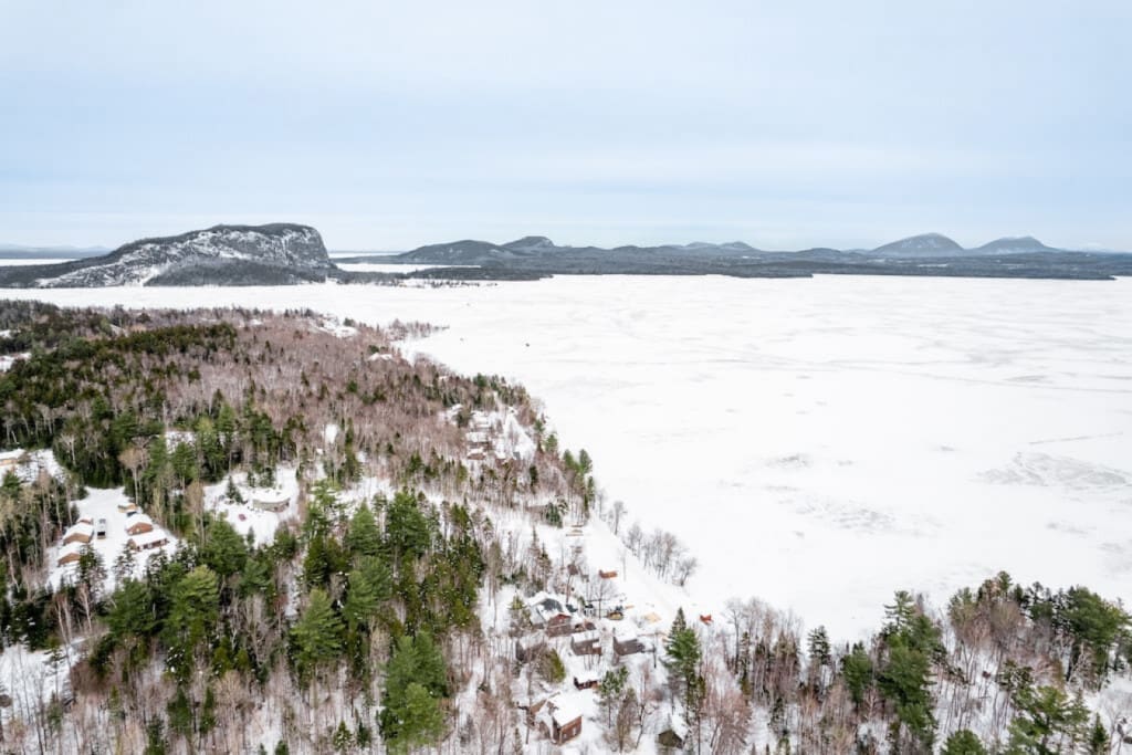 Like a picture-perfect postcard, the cabin sits nestled in a snowy paradise.