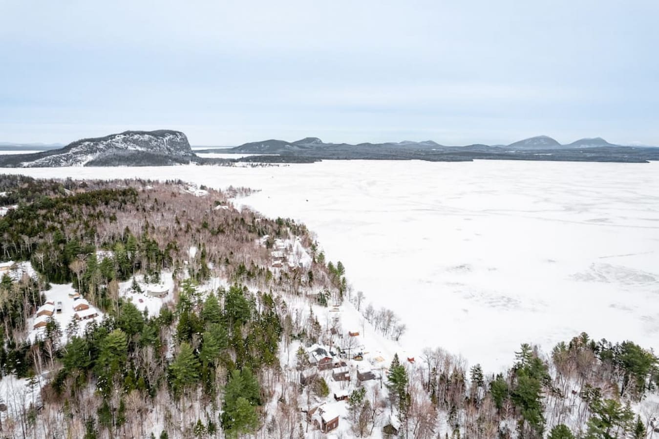 Like a picture-perfect postcard, the cabin sits nestled in a snowy paradise.