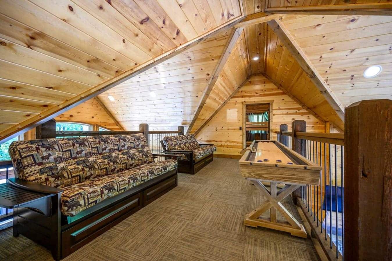 Cozy up in the heart of the cabin, where the lounge area beckons with warmth, comfort, and the promise of cherished moments.
