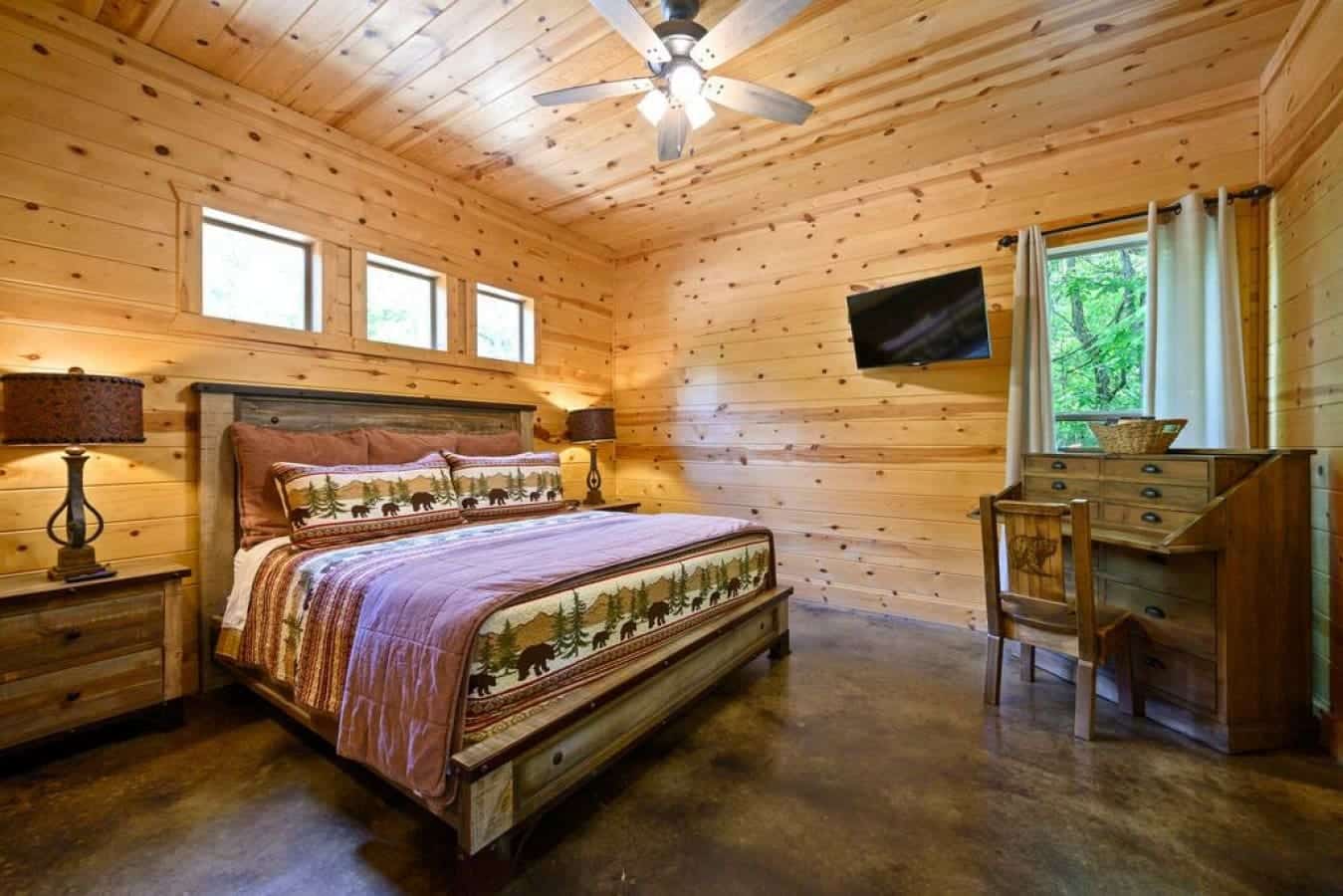 Cozy nights and sweet dreams await in this charming cabin bedroom, a perfect blend of rustic and relaxation.