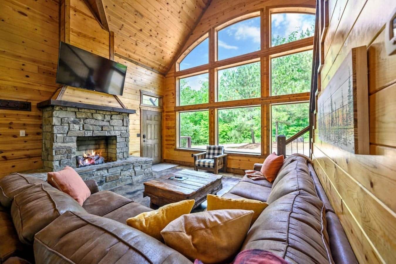 Embrace the ultimate cabin coziness – a roaring fireplace, your favorite shows on the television, and a chair so inviting, it's the epitome of relaxation.