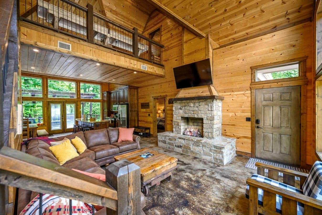 Cabin comfort at its finest – a crackling fireplace, a state-of-the-art television, and a chair so comfortable, it beckons you to unwind in style.