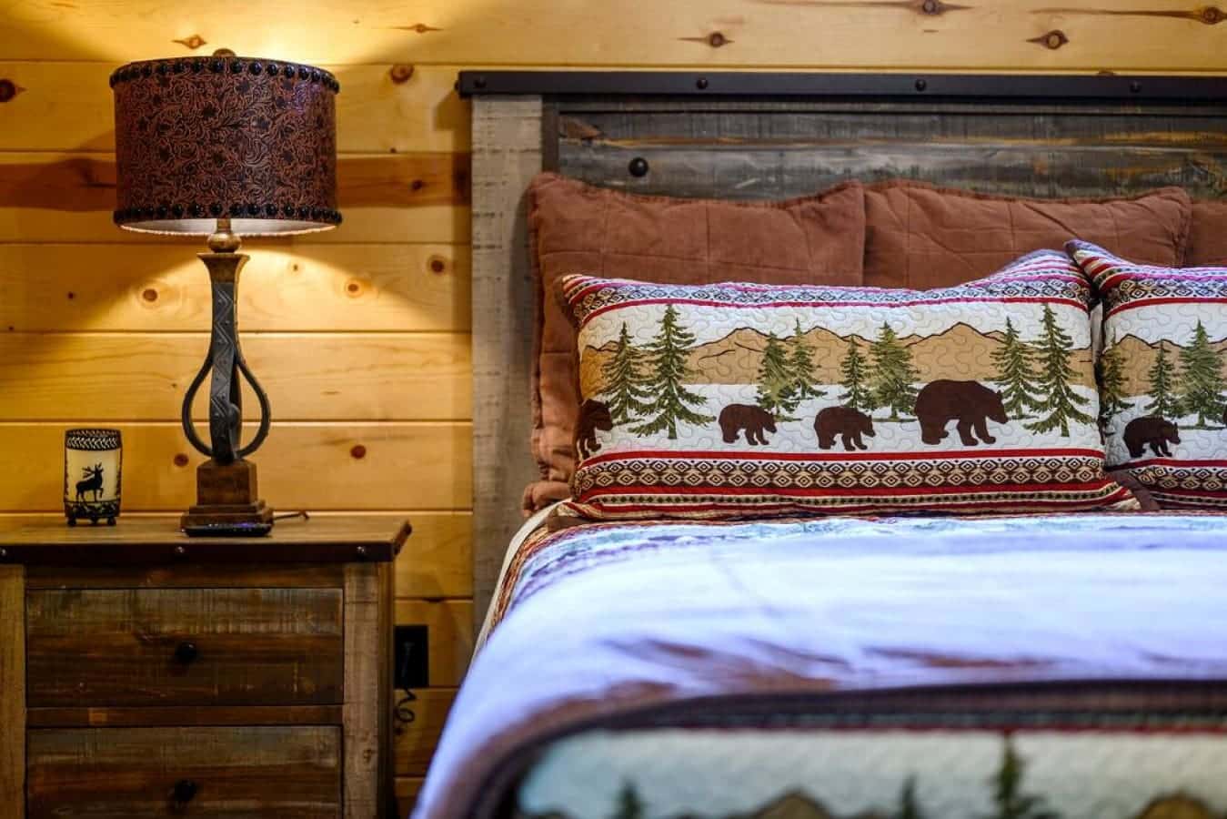 Dreams take flight in this cabin bedroom, where the simplicity of design meets the luxury of a restful night's sleep.