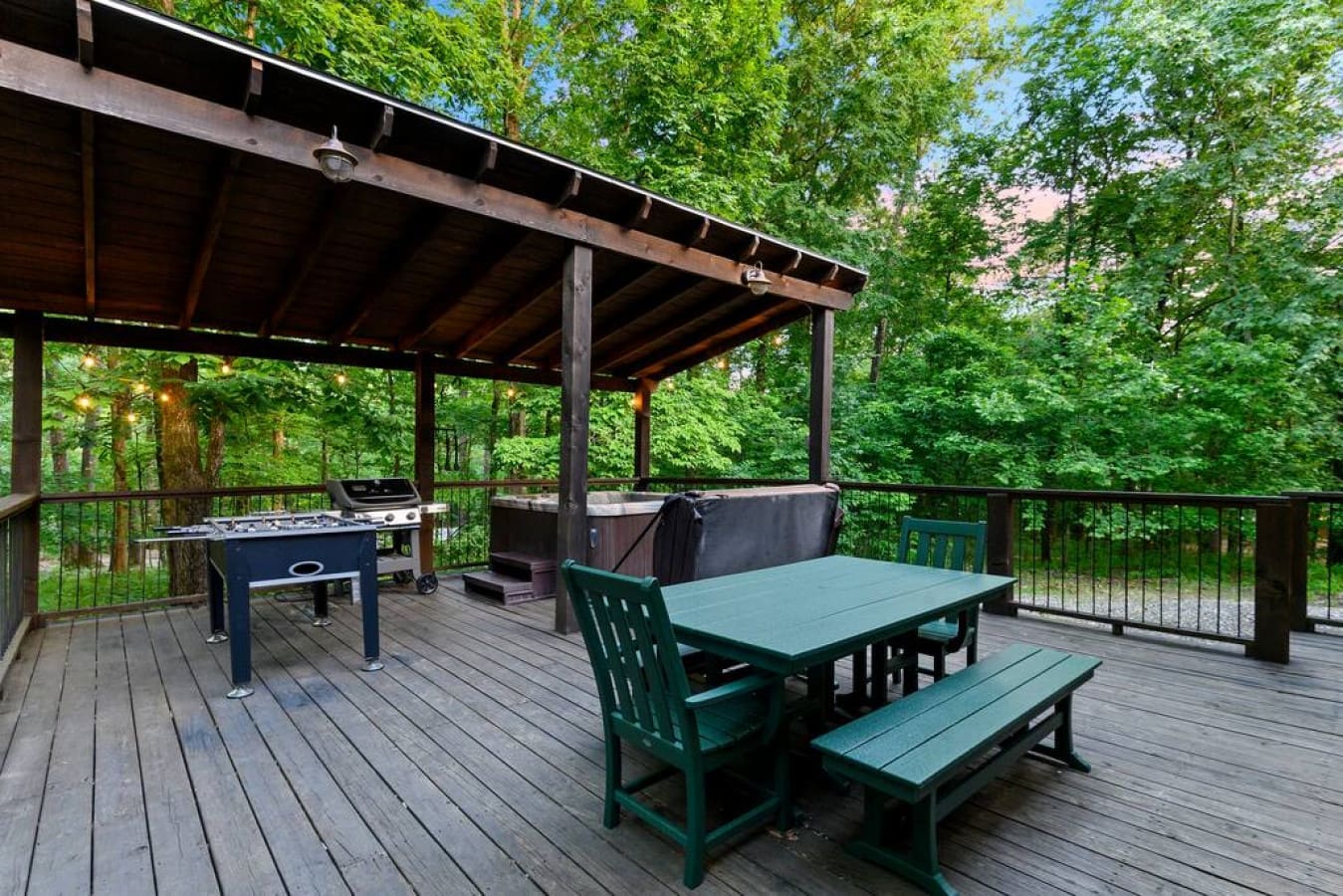 Discover the epitome of cabin luxury on the deck – from the soothing hot tub to the flavorful grill and a table that invites you to dine under the open sky.