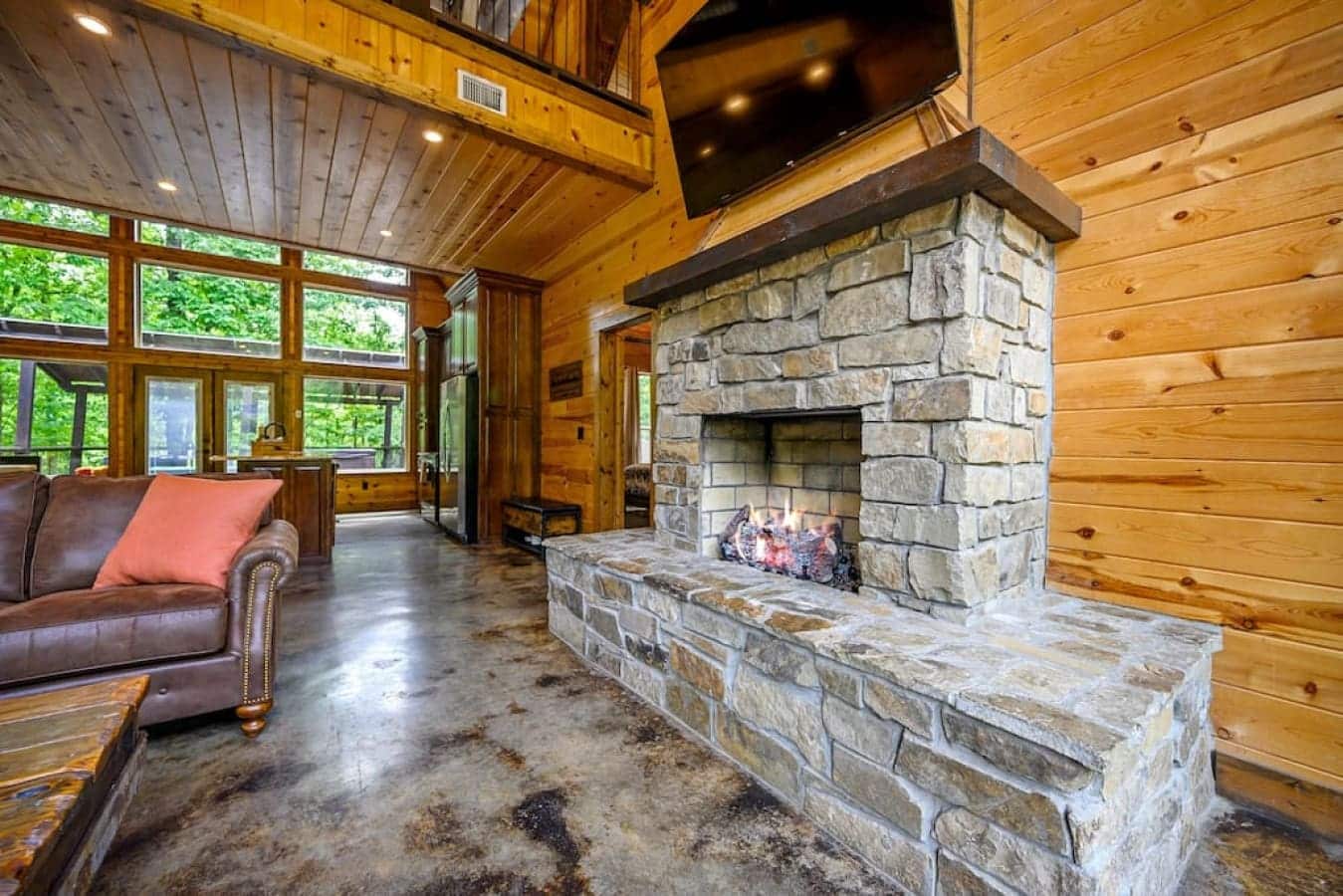 The centerpiece of comfort in this cabin sanctuary – where every flame tells a story and every crackle is a chorus of relaxation.